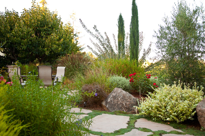 Inspiration for a mediterranean back partial sun garden for summer in San Francisco with natural stone paving.