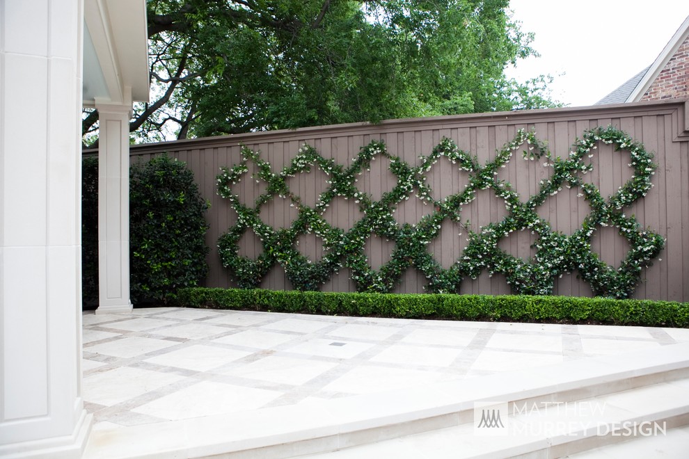 Inspiration for a traditional garden in Dallas with a living wall and natural stone paving.