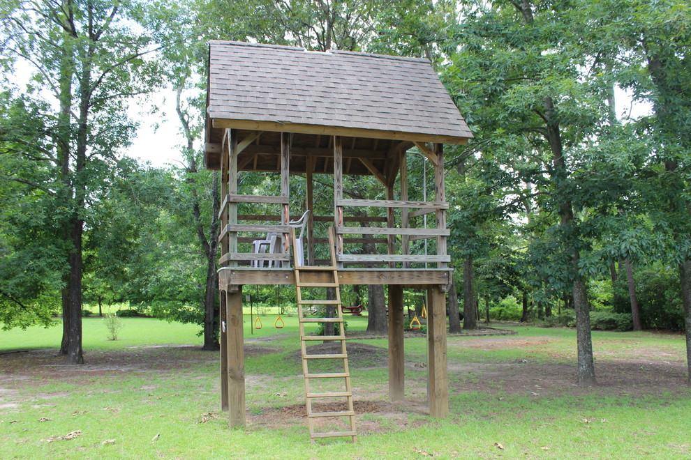 Design ideas for a mid-sized traditional full sun backyard outdoor playset in Raleigh.