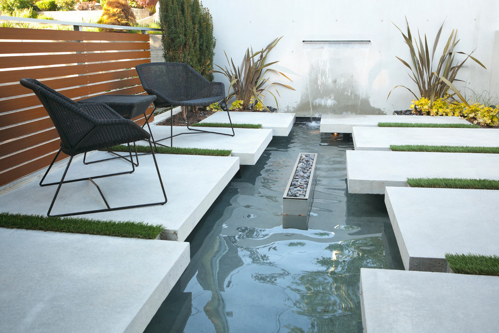 Photo of a modern courtyard landscaping in Vancouver with a fire pit.