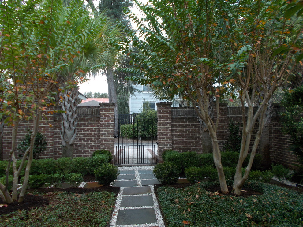 Inspiration for a contemporary courtyard stone garden path in Charleston.