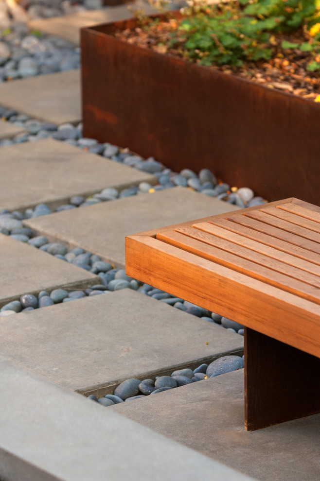 Inspiration for a small modern courtyard fully shaded garden in Sacramento with a retaining wall.