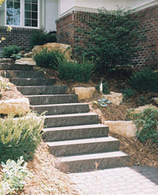 Inspiration for a large front yard concrete paver garden path in Minneapolis.