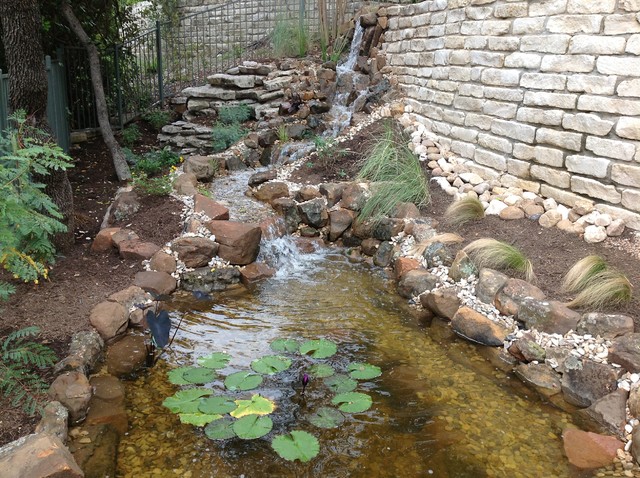 Todd S Pond And Waterfall Through The Retaining Wall Rustic Garden Austin By Texas Ponds And Water Features Llc Houzz