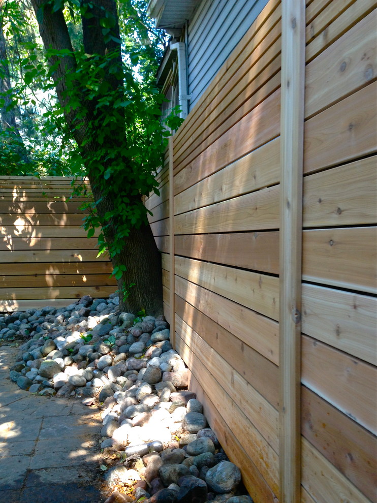 This is an example of a modern garden in Toronto with decking.