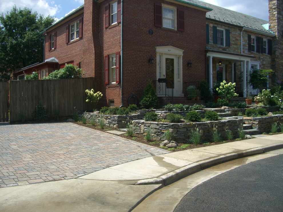 Photo of a mid-sized transitional full sun front yard concrete paver landscaping in DC Metro for spring.