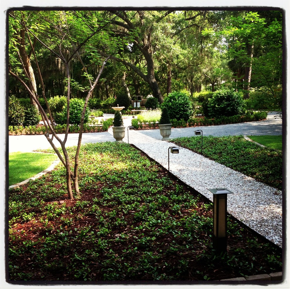 Design ideas for a large traditional partial sun backyard gravel landscaping in Atlanta.
