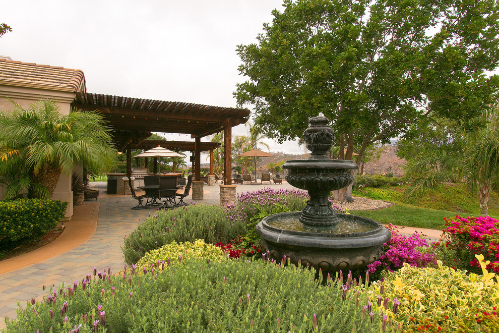 This is an example of a french country water fountain landscape in San Diego.