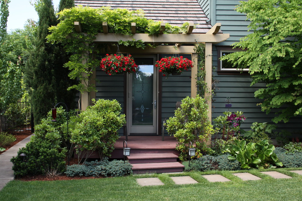 This is an example of a traditional landscaping in Other with a pergola.
