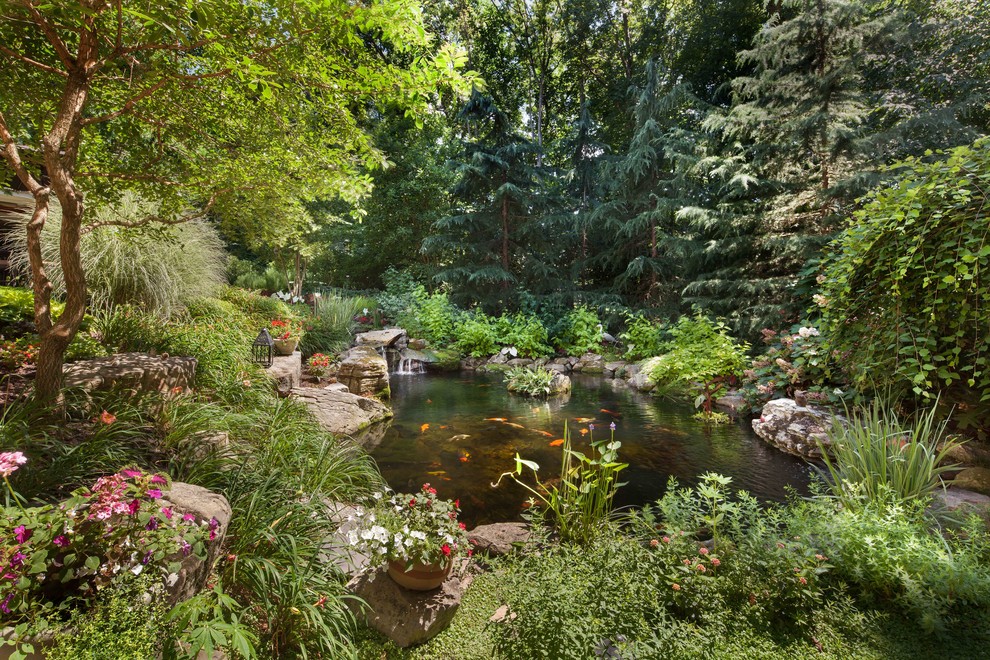 Photo of a huge traditional hillside landscaping in DC Metro for summer.