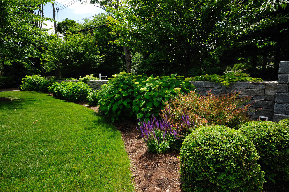 This is an example of a traditional backyard landscaping in New York.