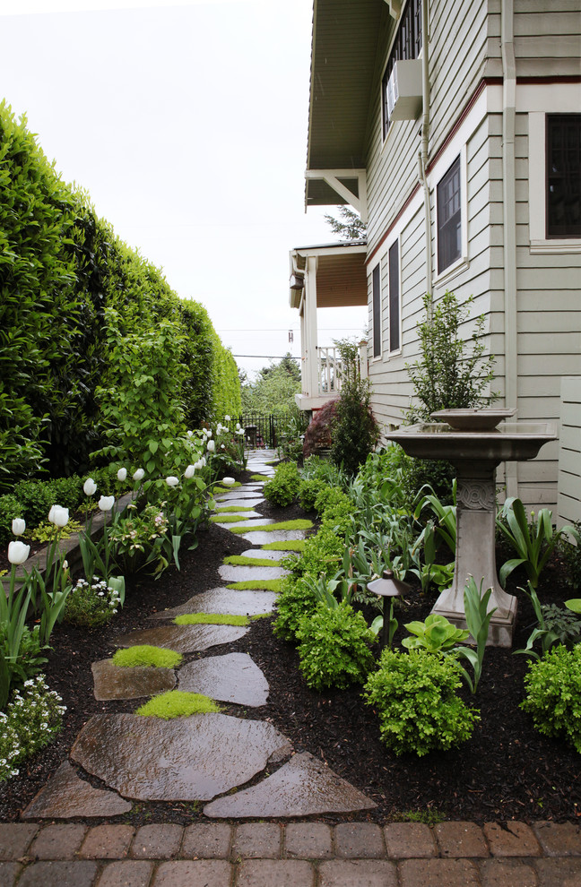 Inspiration for a traditional partial sun side yard stone garden path in Portland for spring.