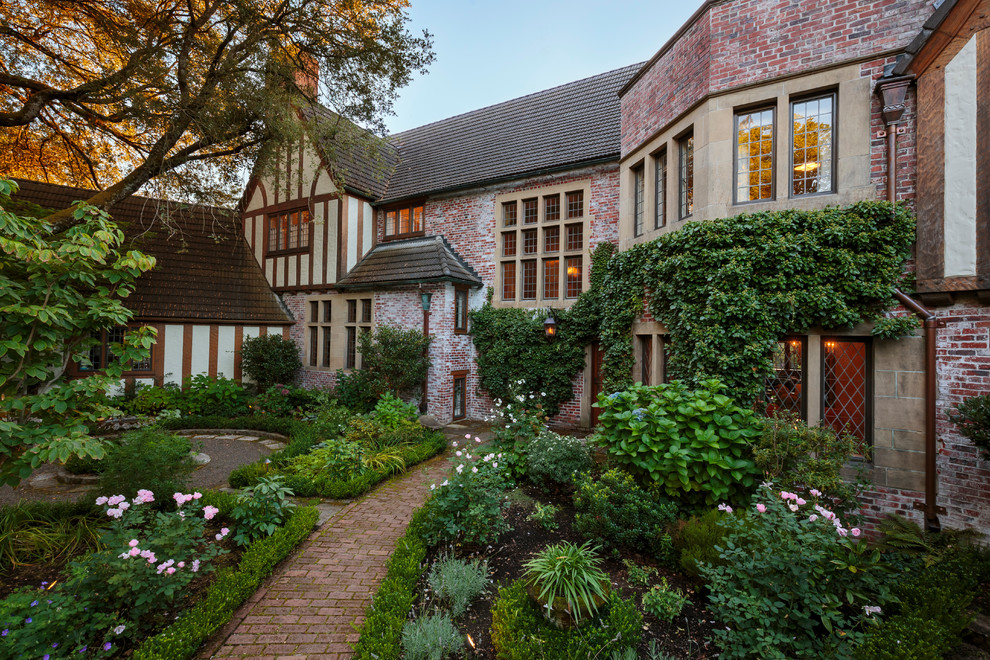 Classic garden in Portland with a garden path and brick paving.