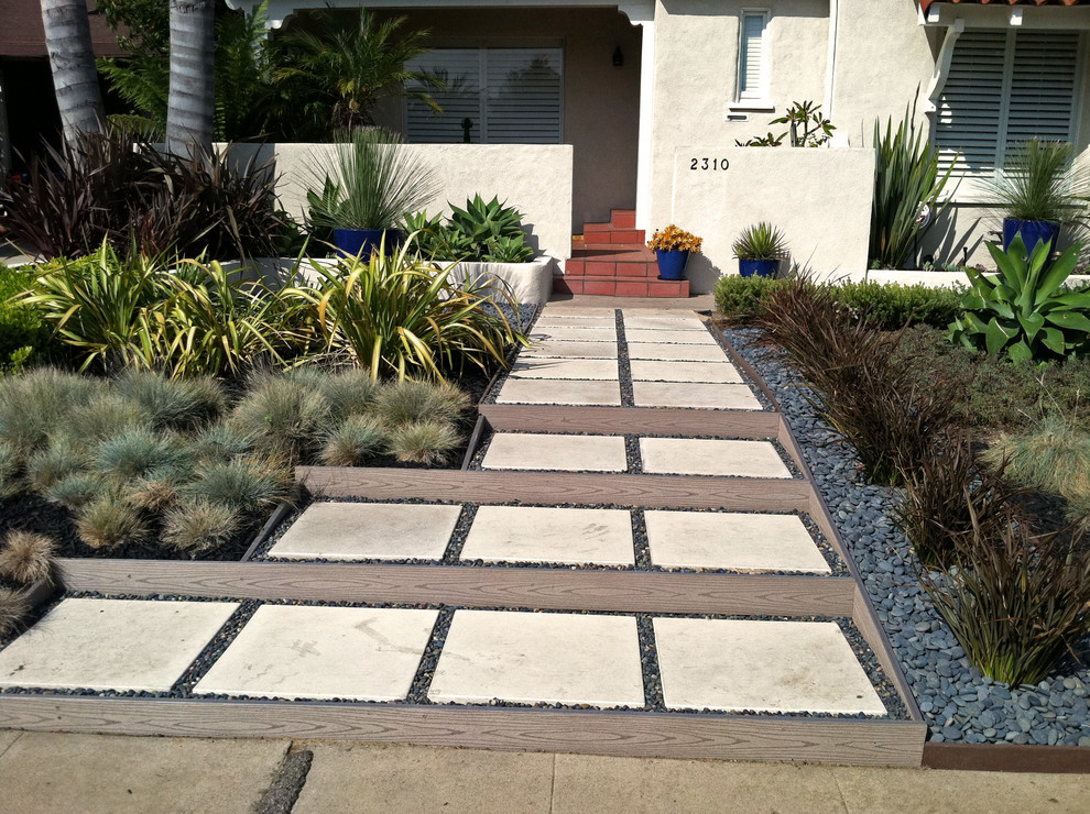 Medium sized contemporary front full sun garden in Los Angeles with a garden path and concrete paving.