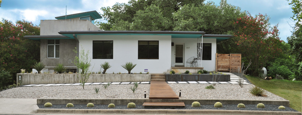 Идея дизайна: солнечный засухоустойчивый сад среднего размера на переднем дворе в стиле модернизм с хорошей освещенностью и покрытием из гравия