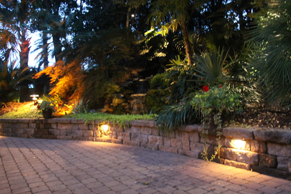This is an example of a mid-sized coastal front yard concrete paver landscaping in Other.