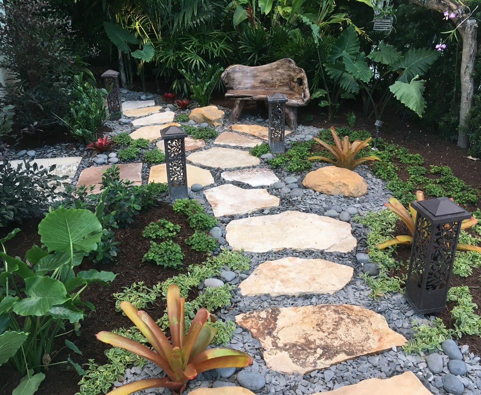 This is an example of a small tropical backyard landscaping in Miami.