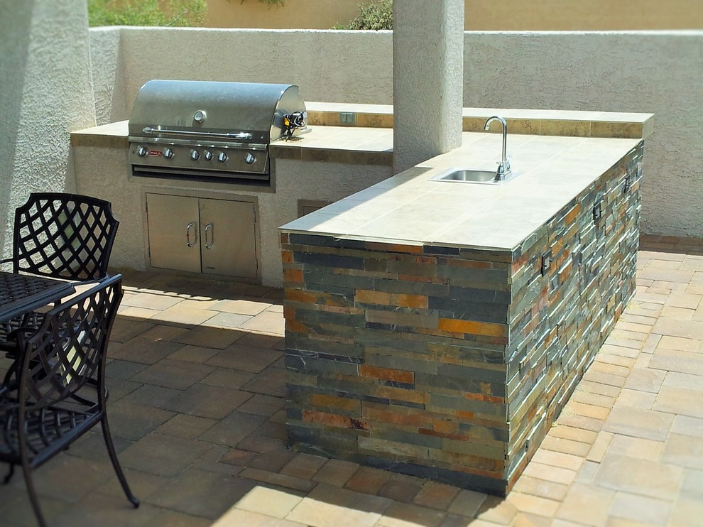 Inspiration for a southwestern stone patio remodel in Other