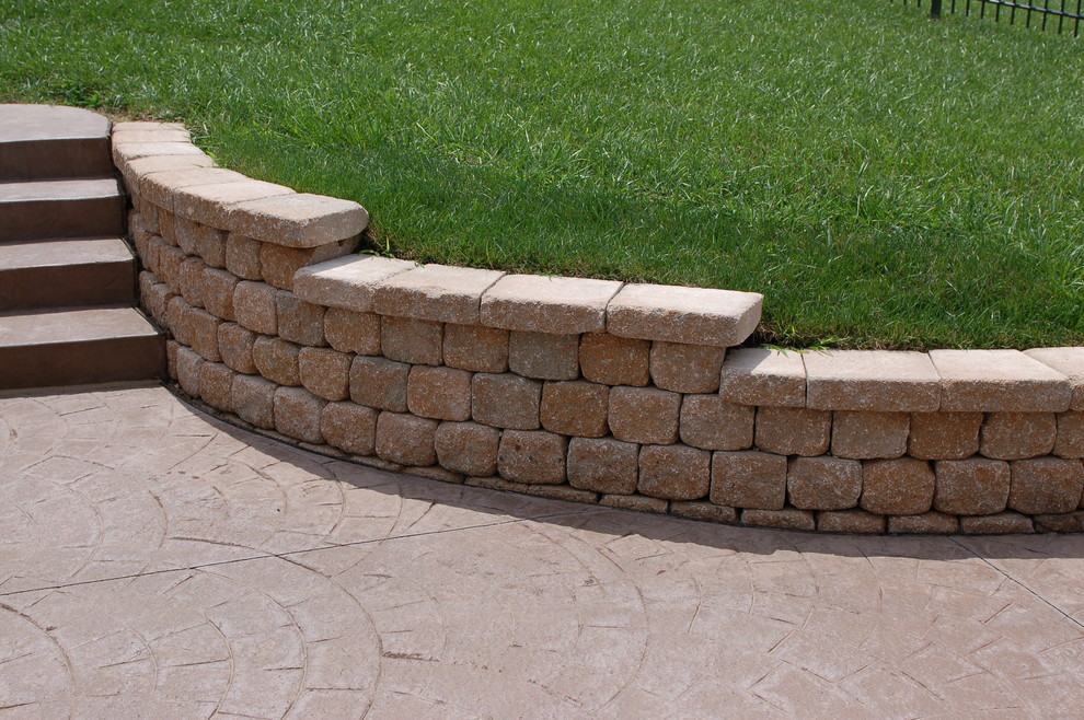 Design ideas for an expansive traditional back garden in Other with a retaining wall.