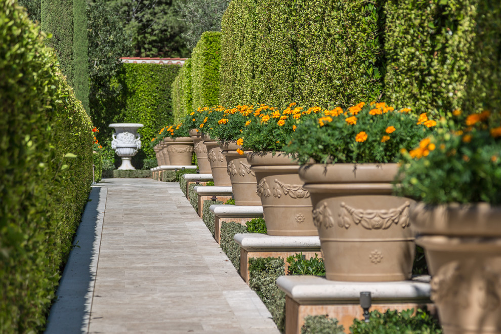 Inspiration for a mediterranean courtyard formal garden in Los Angeles with a garden path.