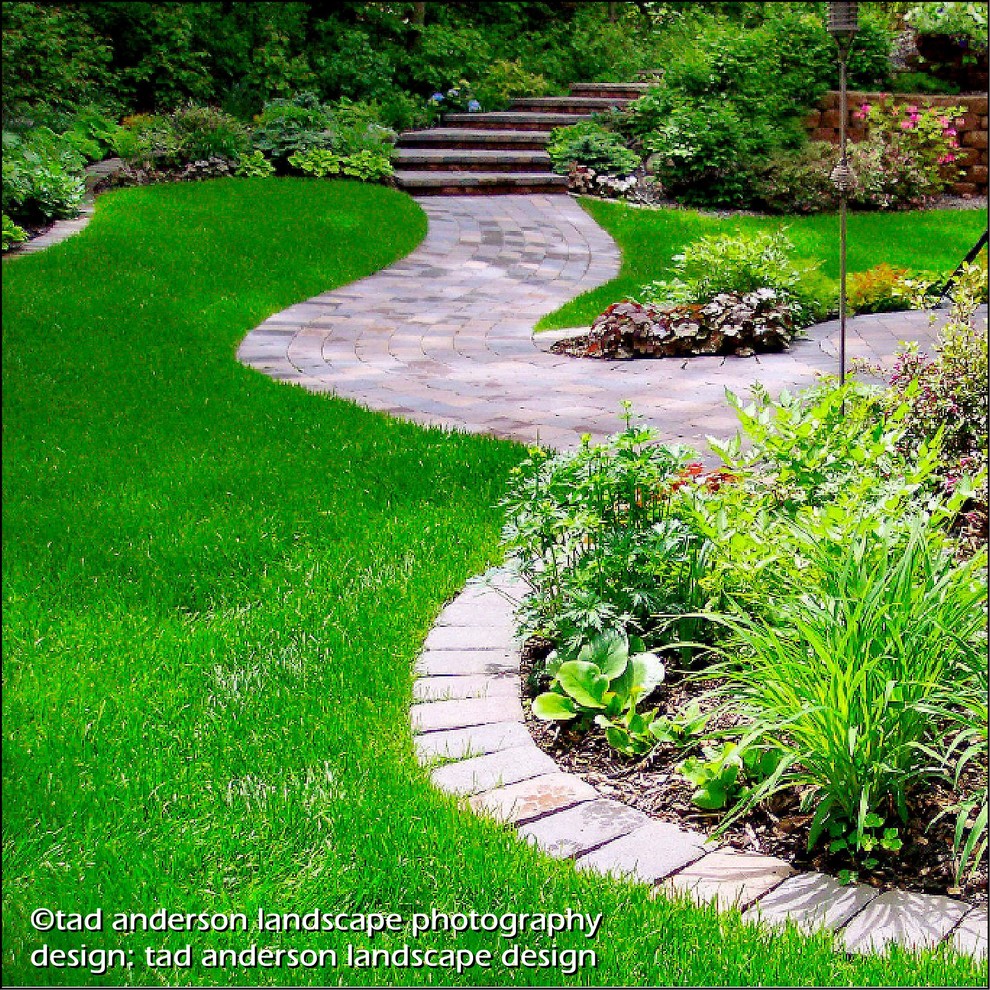 Inspiration for a traditional shade backyard concrete paver landscaping in Minneapolis for summer.