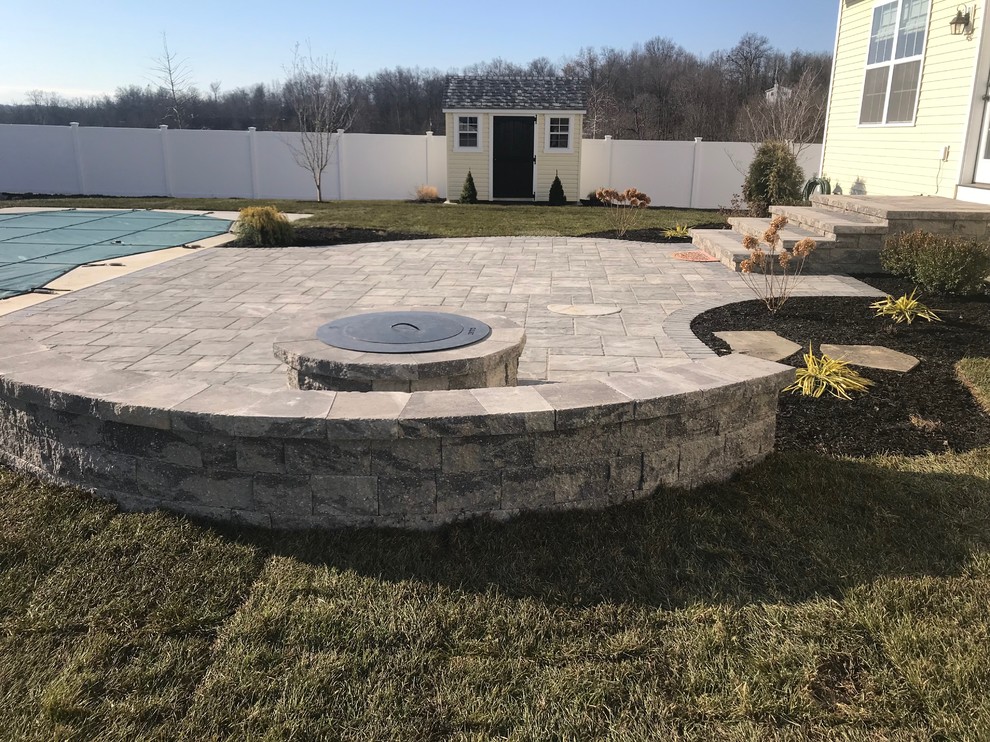 Unilock patio,firepit,plantings,sod Traditional Landscape New