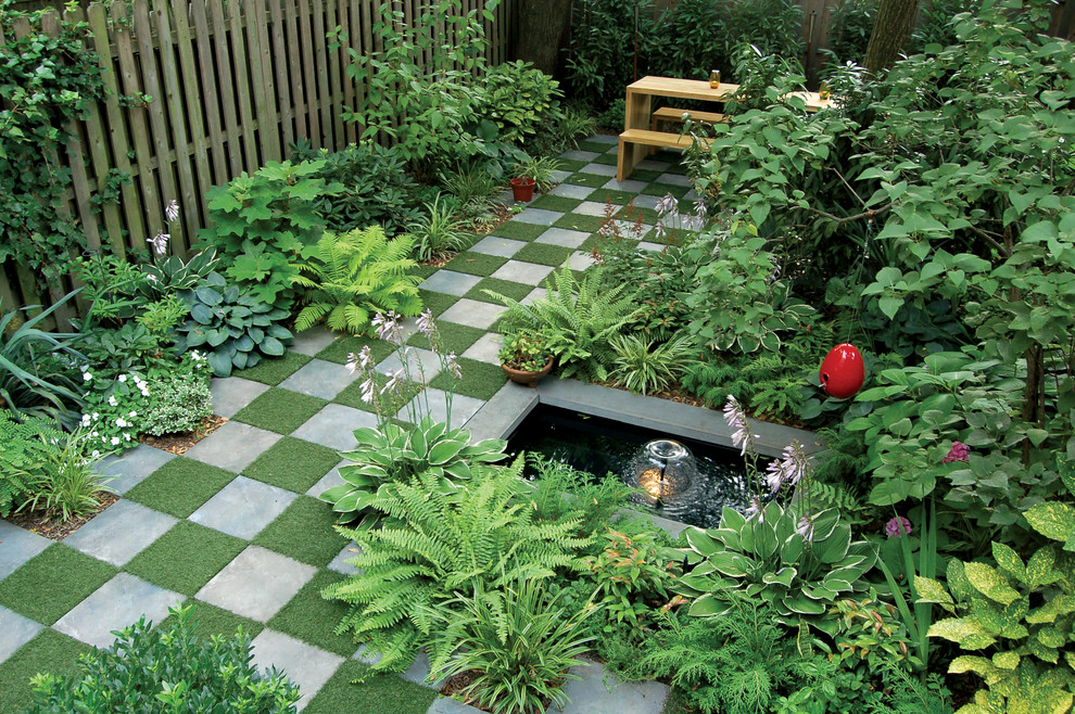Photo of a traditional shade backyard landscaping in New York.