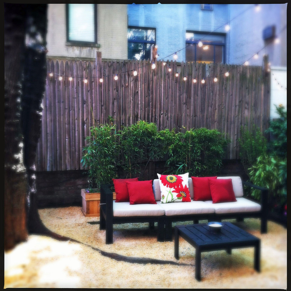 Design ideas for a contemporary shade backyard gravel landscaping in New York.