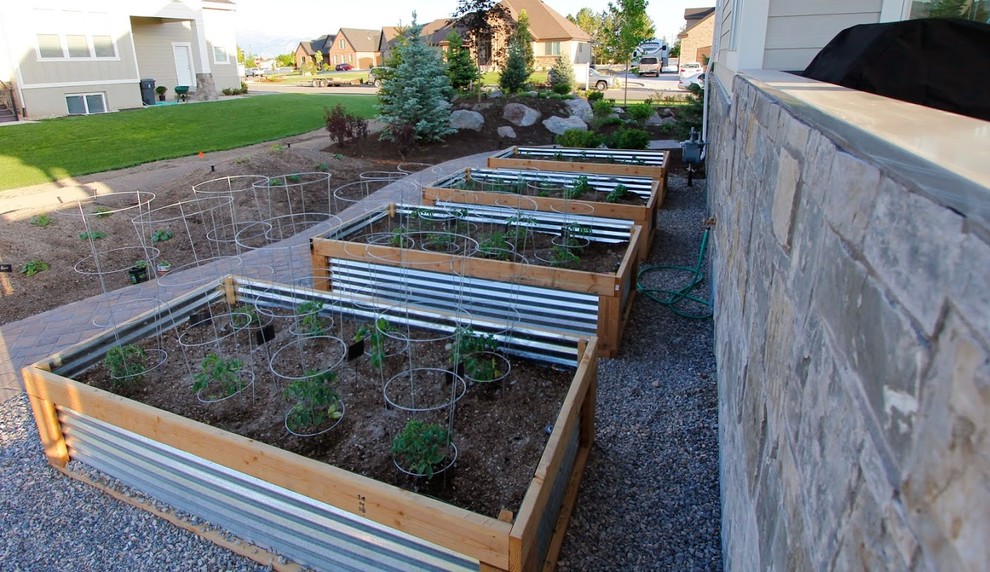 Design ideas for a large farmhouse partial sun side yard concrete paver vegetable garden landscape in Salt Lake City for summer.