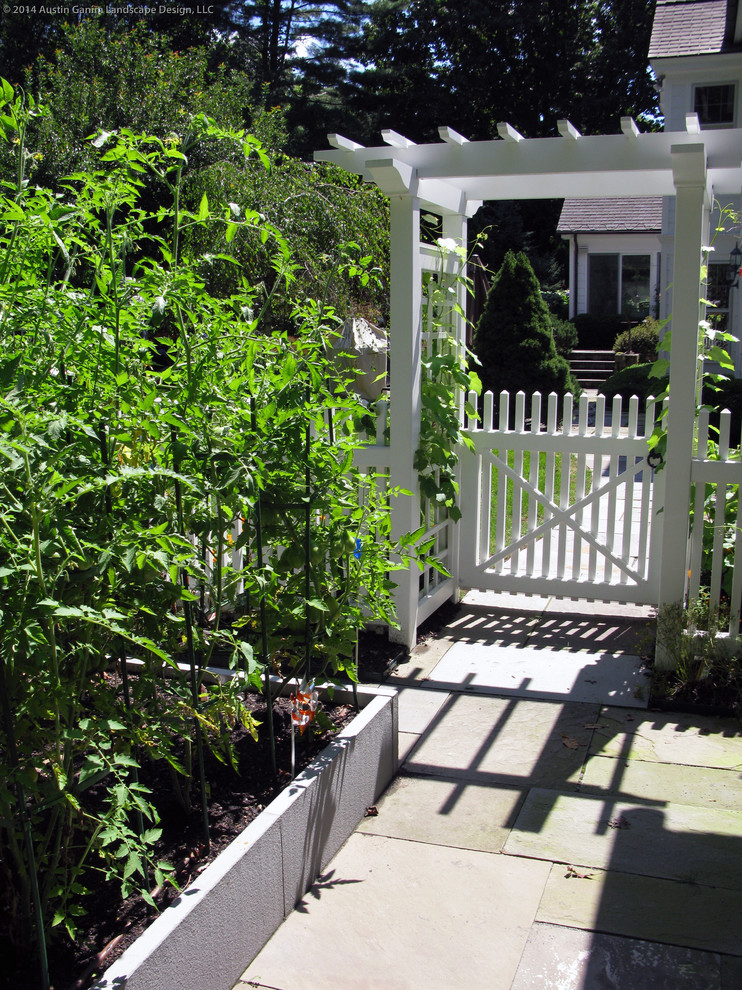 Design ideas for a traditional full sun backyard stone vegetable garden landscape in Bridgeport for summer.
