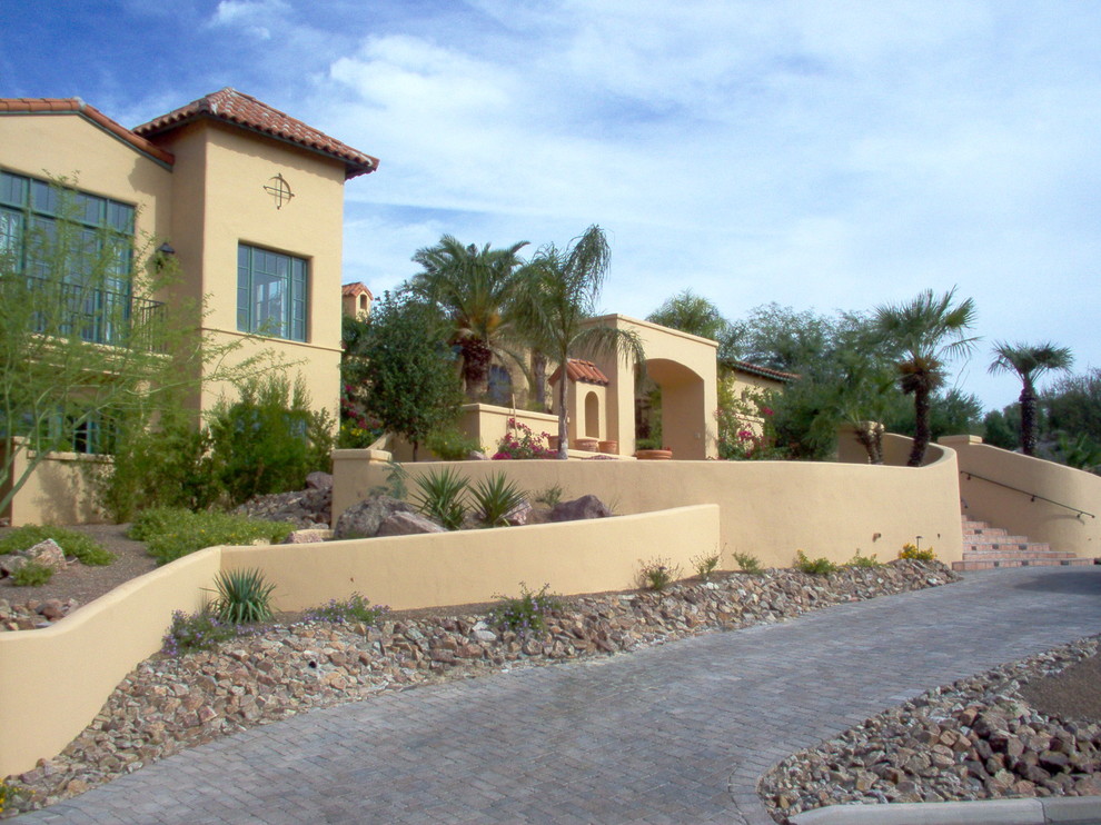 Inspiration for a large front xeriscape full sun garden in Phoenix with brick paving.
