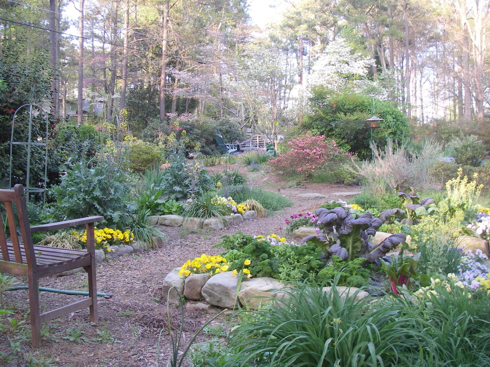 Medium sized classic front formal full sun garden for summer in Atlanta with a vegetable patch.