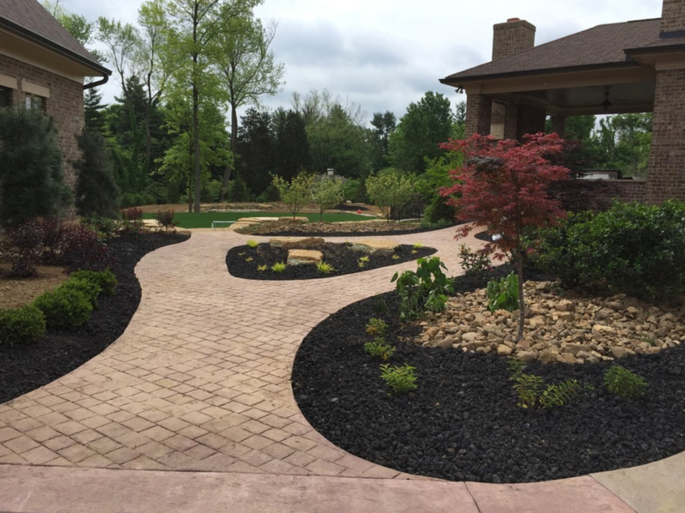 Design ideas for a large drought-tolerant and full sun courtyard concrete paver garden path in Cincinnati.