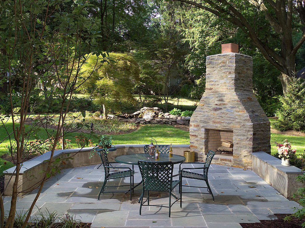 Photo of a medium sized victorian back patio in Philadelphia with a fire feature and natural stone paving.