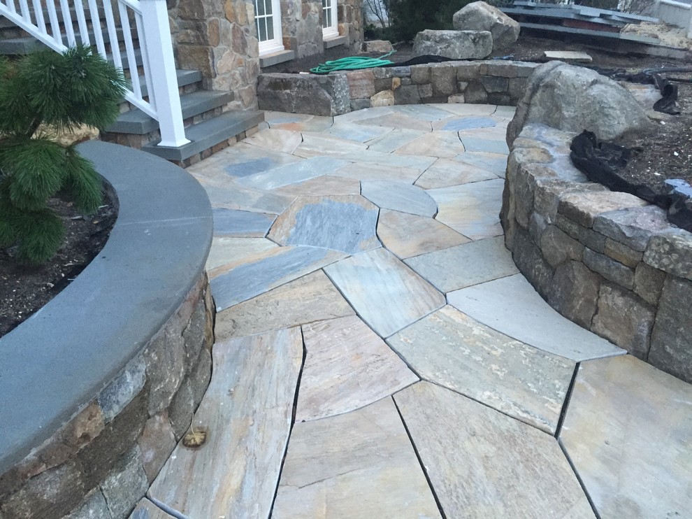 Coastal front garden in New York with natural stone paving.