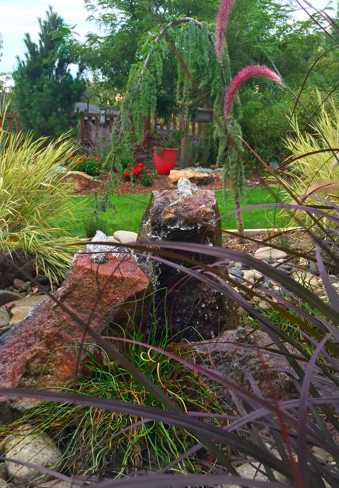 Photo of a medium sized contemporary back garden in Boise with a water feature.