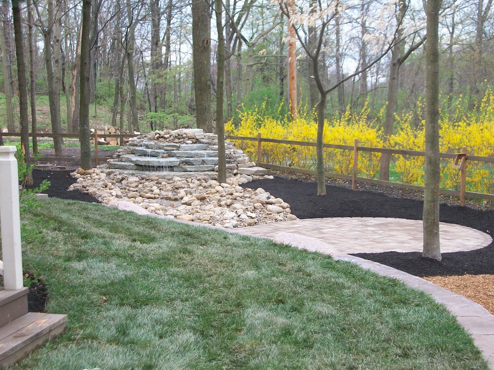 Water Feature and Patio in The Woods at Josephenum Rustic Landscape Columbus by Pony