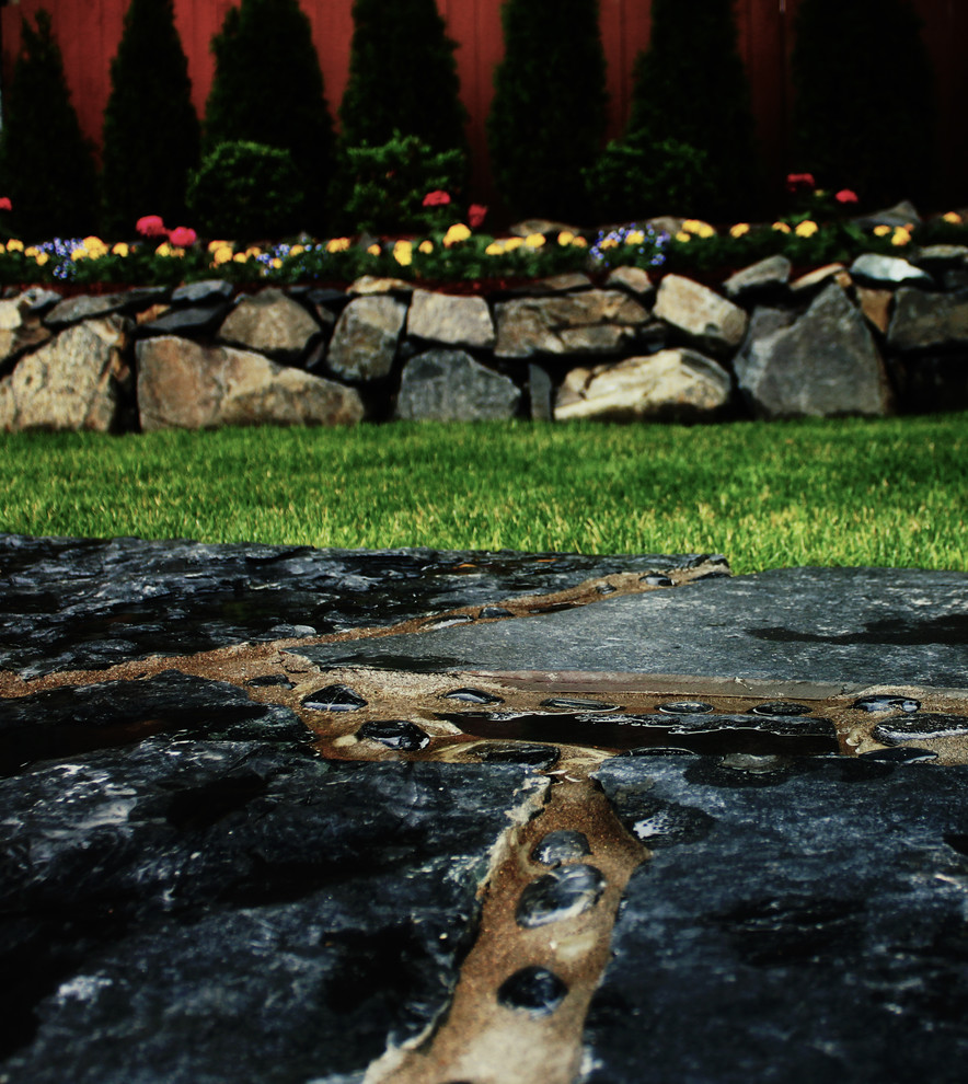 Water feature, decorative rock, & faux rock landscaping remodel