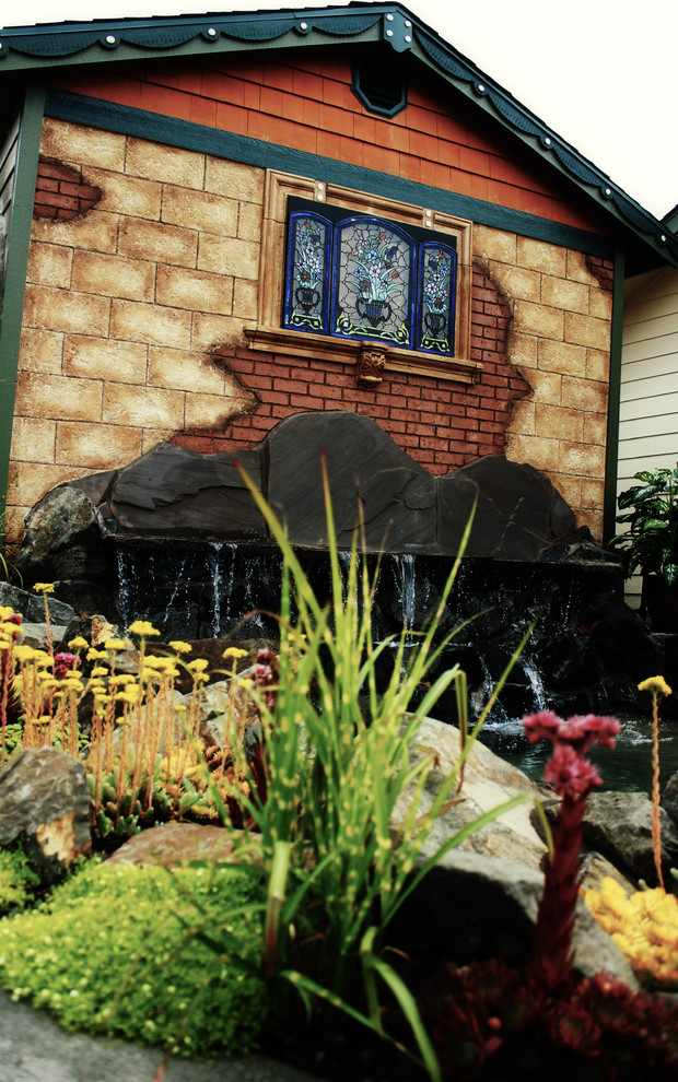 Water feature, decorative rock, & faux rock landscaping remodel