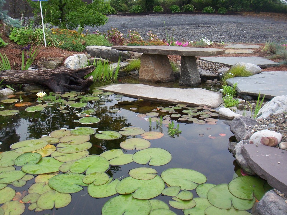 Inspiration for a traditional garden in Philadelphia with a water feature.