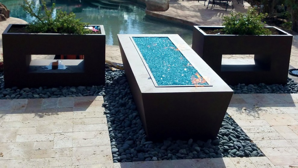Inspiration for a contemporary landscaping in Phoenix with a fire pit.