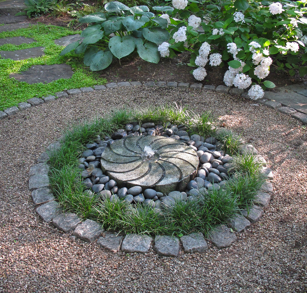 Design ideas for a small classic side formal fully shaded garden for summer in DC Metro with a water feature and gravel.