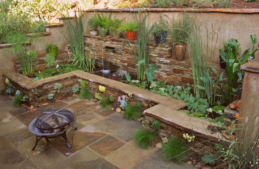 This is an example of a mid-sized transitional backyard stone landscaping in Santa Barbara.