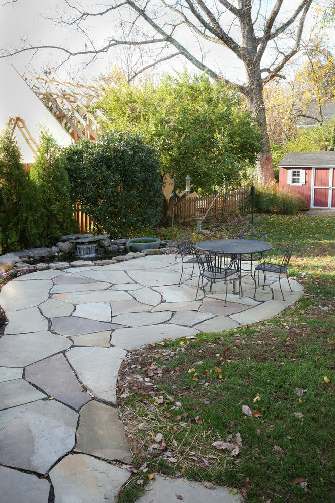 Photo of a small craftsman partial sun backyard stone water fountain landscape in DC Metro for fall.