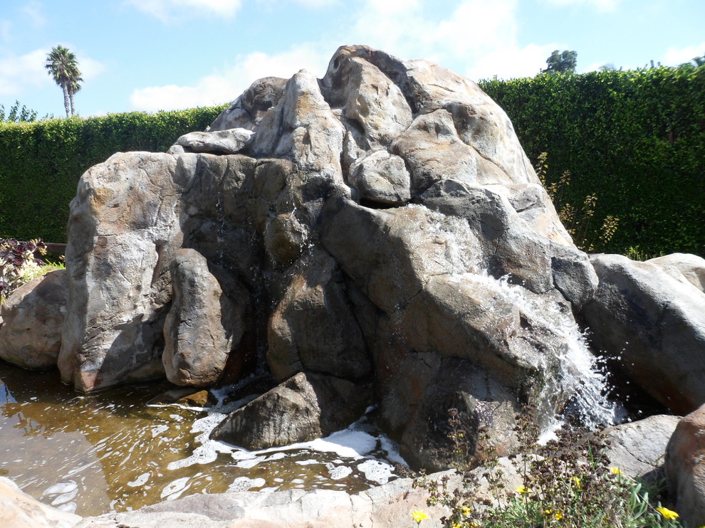 Inspiration for a rustic backyard water fountain landscape in San Diego.
