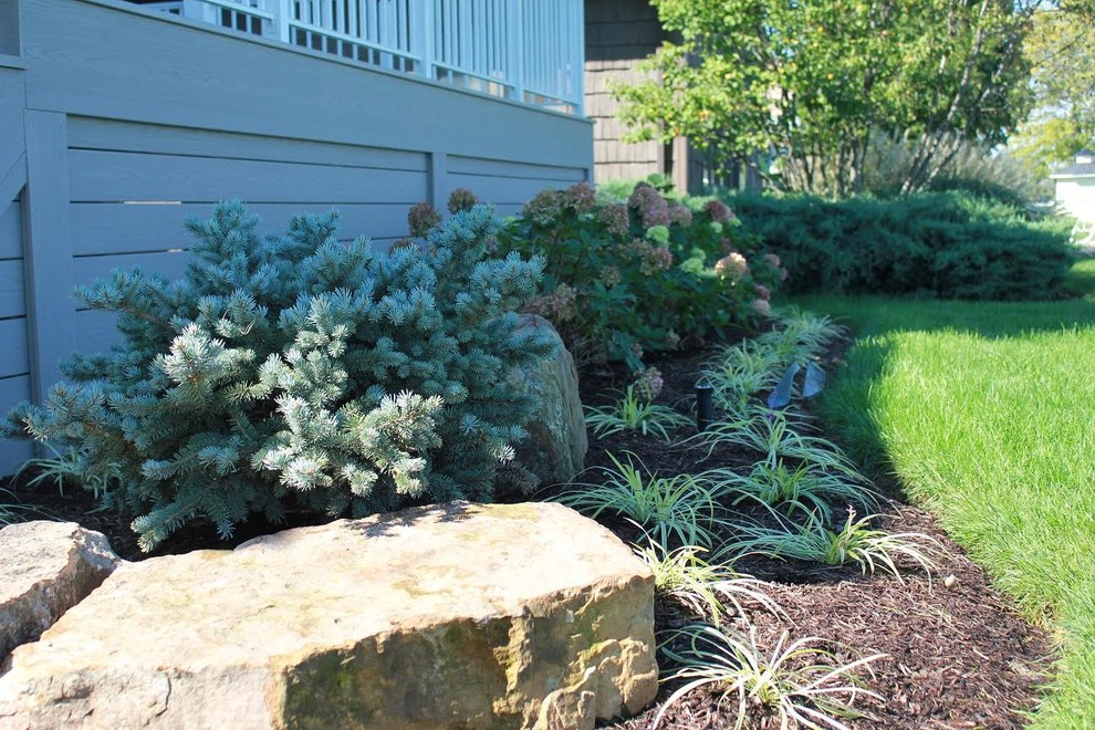 This is an example of a mid-sized craftsman partial sun side yard landscaping in Other.