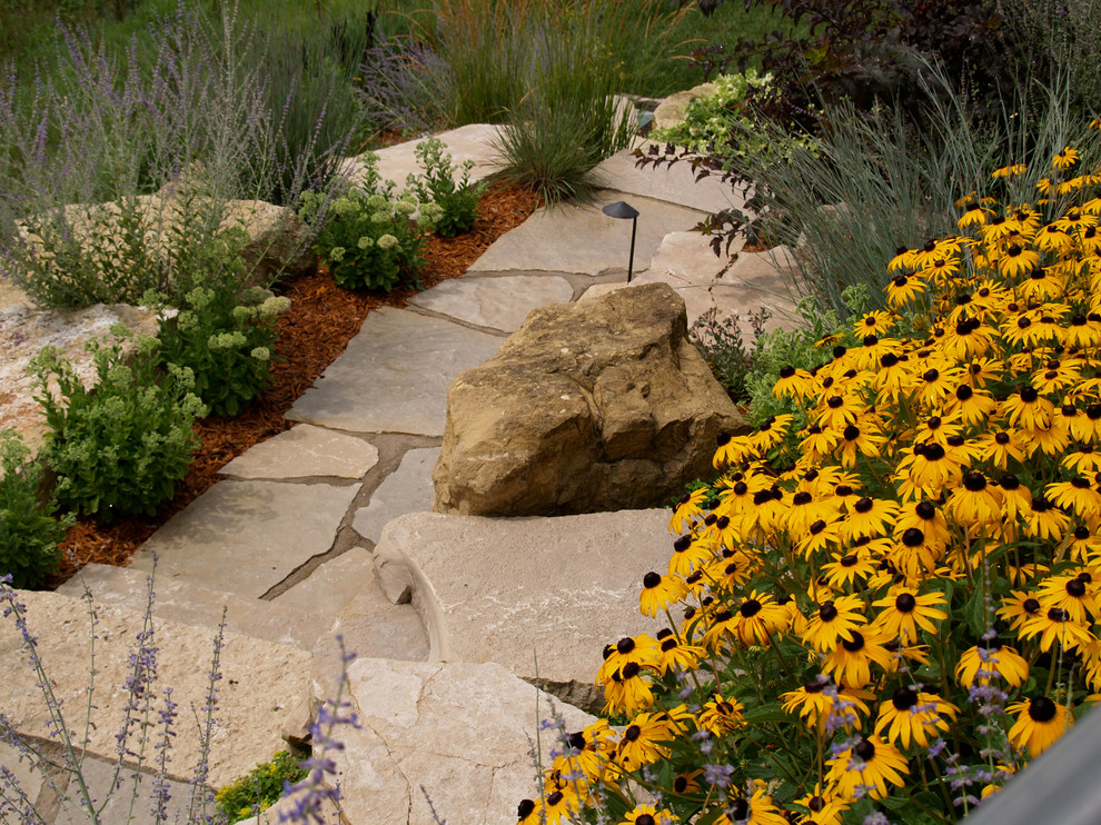 Design ideas for a large traditional full sun backyard concrete paver landscaping in Minneapolis.