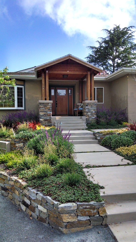 Inspiration for a mid-sized traditional partial sun front yard retaining wall landscape in San Francisco.
