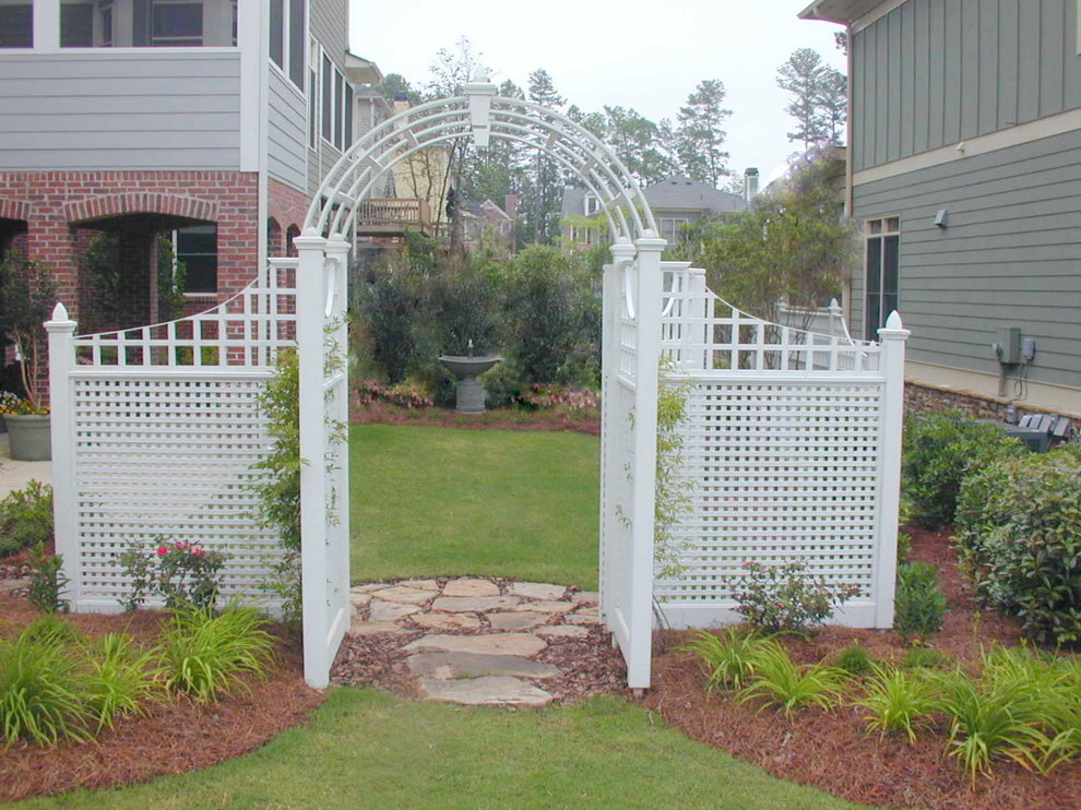 Inspiration for a mid-sized traditional partial sun backyard stone garden path in Atlanta.