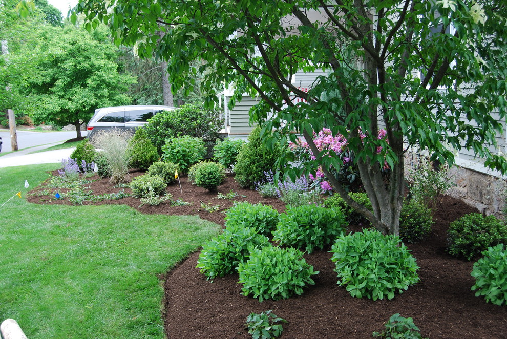 Design ideas for a mid-sized traditional partial sun front yard stone landscaping in Boston.